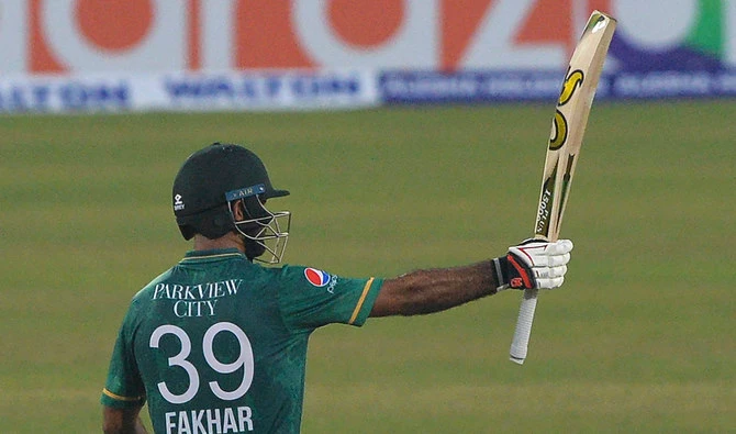 Pakistan’s Fakhar Zaman raises his bat to celebrate a half century during the second Twenty20 International against Bangladesh. (AFP)