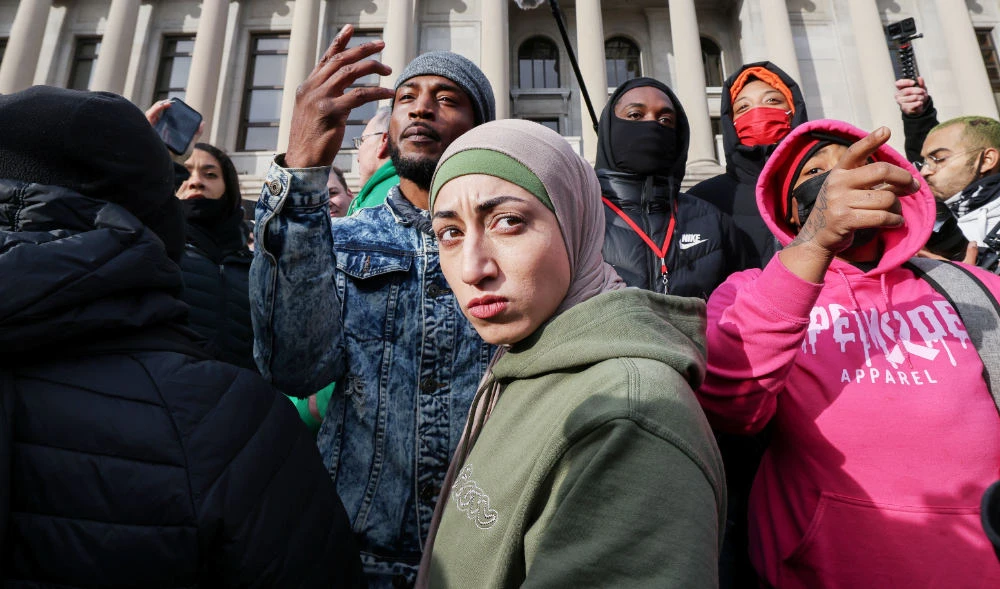 People react to the verdict in the trial of Kyle Rittenhouse, in Kenosha, Wisconsin, U.S., November 19, 2021. (REUTERS)