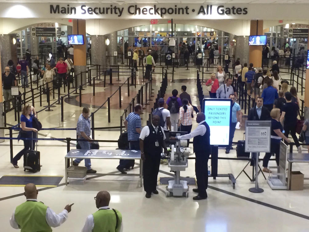 In this Friday, May 27, 2016, file photo taken from video, travelers pass through the main security gate at Hartsfield-Jackson Atlanta International Airport, in Atlanta. (AP)