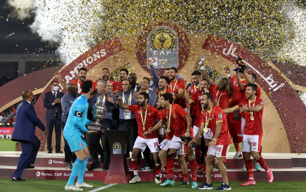 Ahly's players celebrate with the trophy after winning the CAF Super Cup football match between Egypt Al-Ahly and Morocco's Berkane. Getty Images