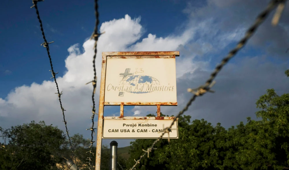 This Oct. 21, 2021, photo shows a sign outside Christian Aid Ministries in Titanyen, Haiti, which had 17 of their members kidnapped by the 400 Mawozo gang. (AP)