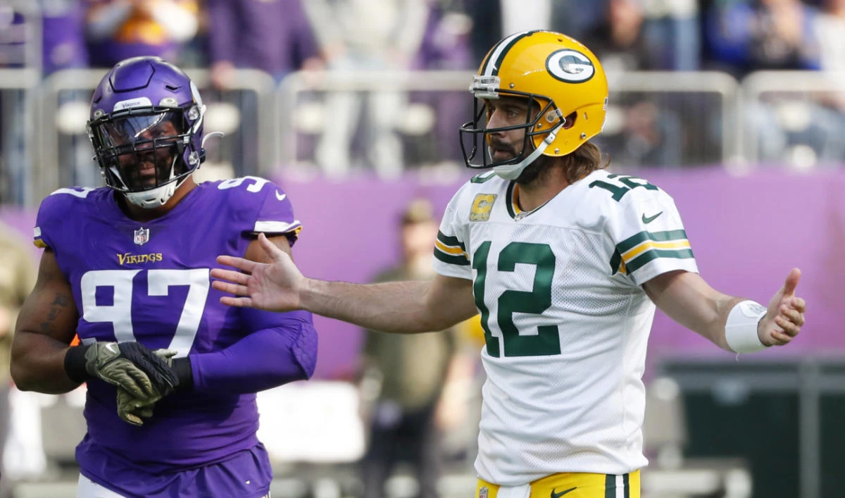Green Bay Packers quarterback Aaron Rodgers (12) reacts to a call in front of Minnesota Vikings defensive end Everson Griffen (97) during the first half of an NFL football game, Sunday, Nov. 21, 2021, in Minneapolis. (AP)