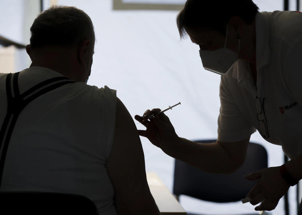 EU should make COVID-19 booster shot a condition for free travel, Greek PM says