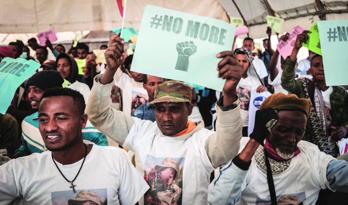 New military recruits who are joining the Ethiopian National Defense Force shout slogans as they attend the send-off ceremony in Addis Ababa on Wednesday. (AFP)
