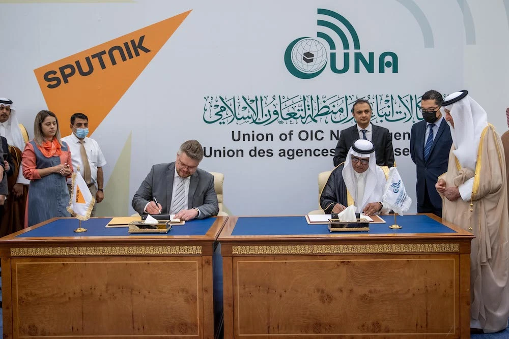 The memorandum was signed by UNA Acting Director General Mohammed Al-Yami, right, and Sputnik Director for International Cooperation Vasily Pushkov. (Supplied)