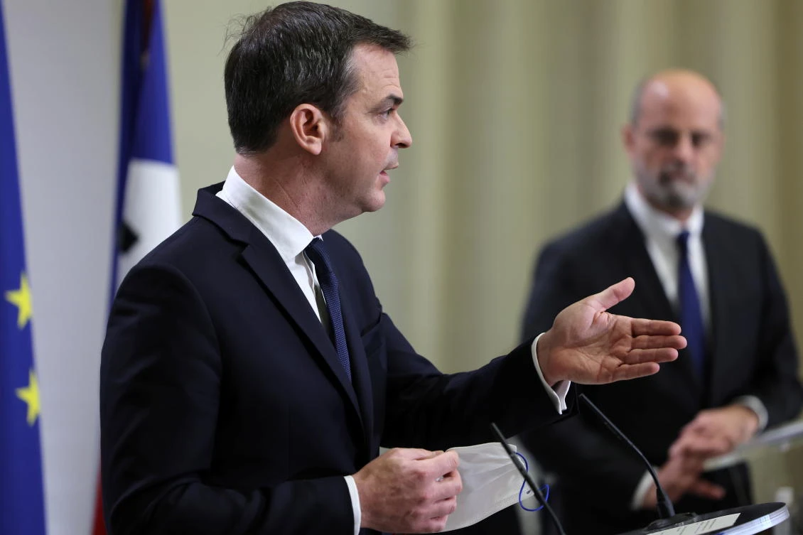 France’s Health Minister Olivier Veran flanked by France’s Education, Youth and Sports Minister Jean-Michel Blanquer, during a news conference on upcoming new governmental measures to curb COVID-19 spread, on Thursday. (Reuters)