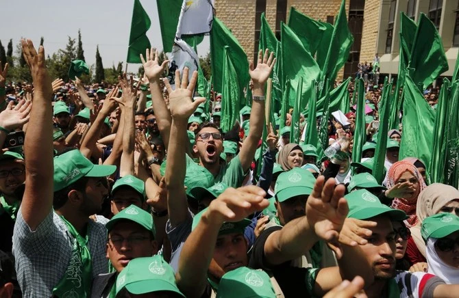 Palestinian students supporting the Hamas movement take part in an election campaign near the West Bank city of Ramallah. (AFP/File Photo)