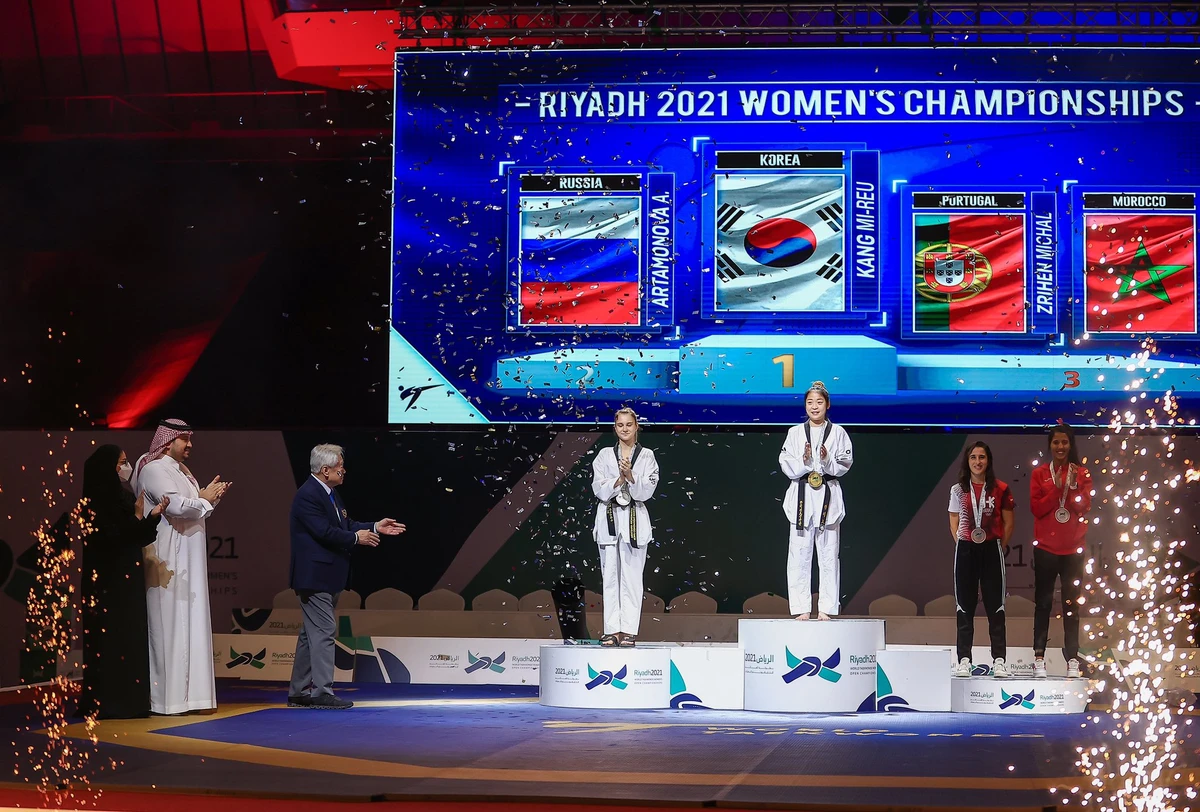 The top three finishers at the World Taekwondo Women's Open Championships in Riyadh are presented with medals. (@saudiolympic)