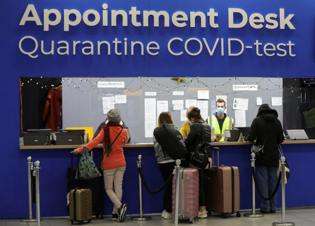 The couple left the hotel where travelers who tested positive for the virus were staying after arriving at Amsterdam’s Schiphol airport, above, from South Africa. (Reuters)
