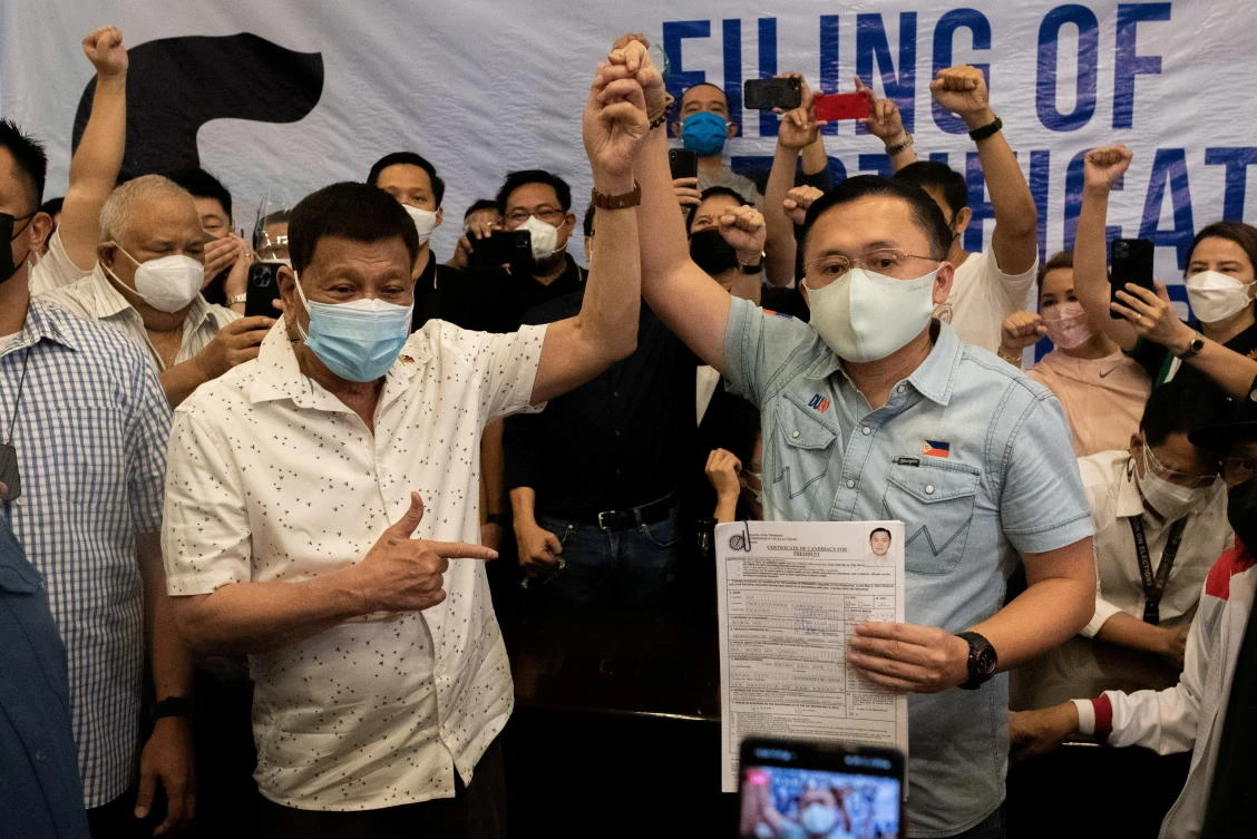 Senator Christopher Go, right, has been a long-time aide, of Philippine president Rodrigo Duterte. (Reuters)