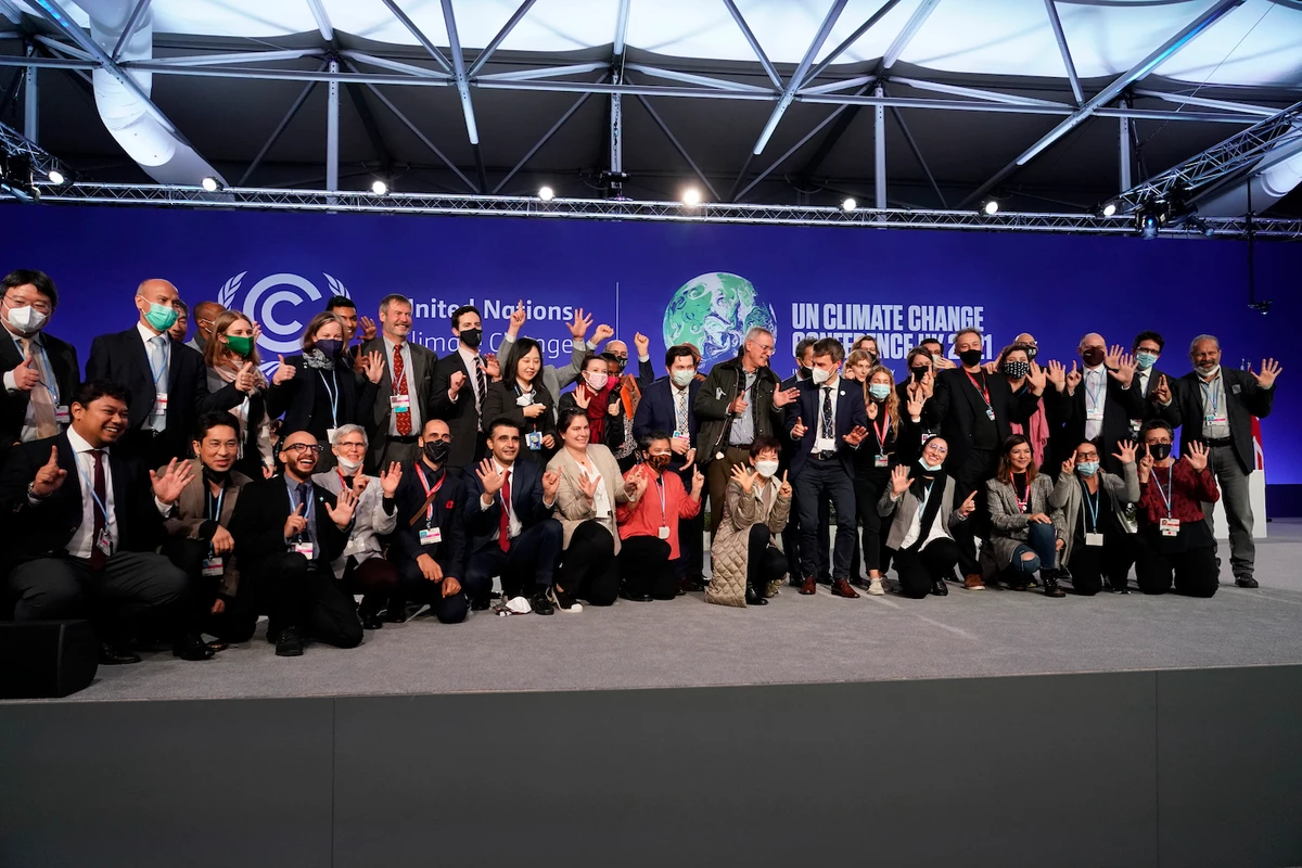 Delegates from different countries pose for a group photo at COP26 UN Climate Summit, in Glasgow, Scotland on Nov. 13, 2021. (AP)