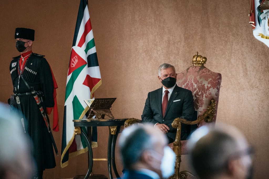 Above, Jordan’s King Abdullah II meets with parliament members in Amman on Nov. 28, 2021. (Jordanian Royal Palace via AFP)