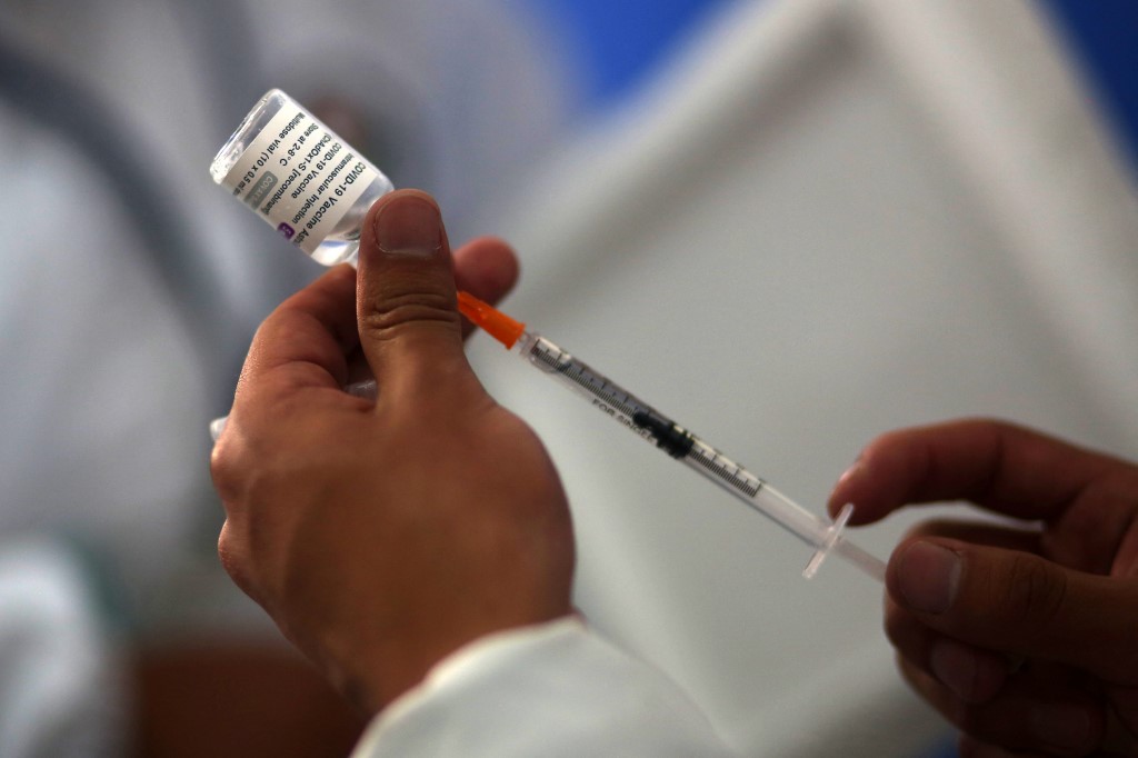 Those who are against vaccines are a minority, while the vast majority of people everywhere are complying with the calls for them to vaccinate. (AFP)