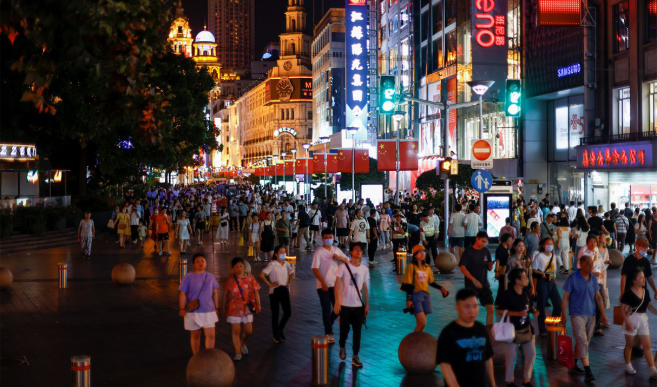 People visit a main shopping area in Shanghai, China. (Reuters/File)
