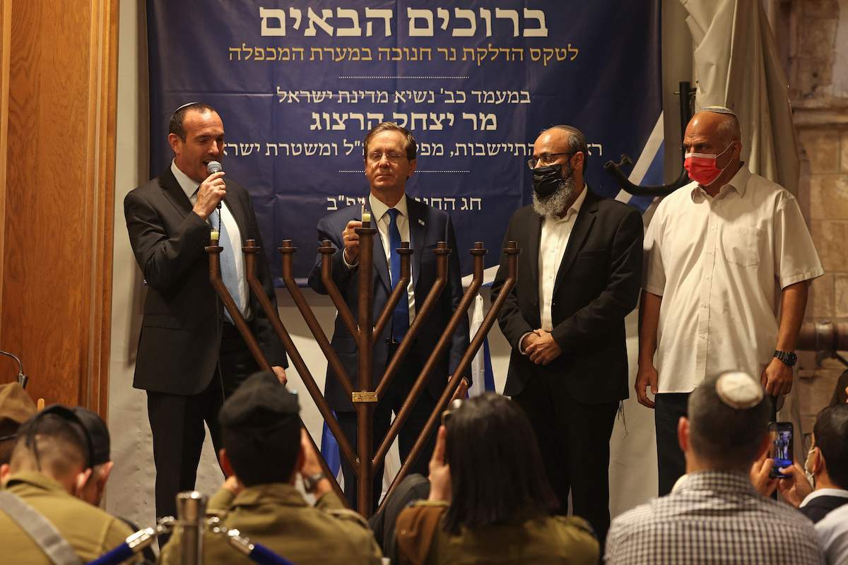 Israeli President Isaac Herzog, 2nd left, at the Ibrahimi mosque in the West Bank city of Hebron, Nov. 28, 2021. (Getty Images)