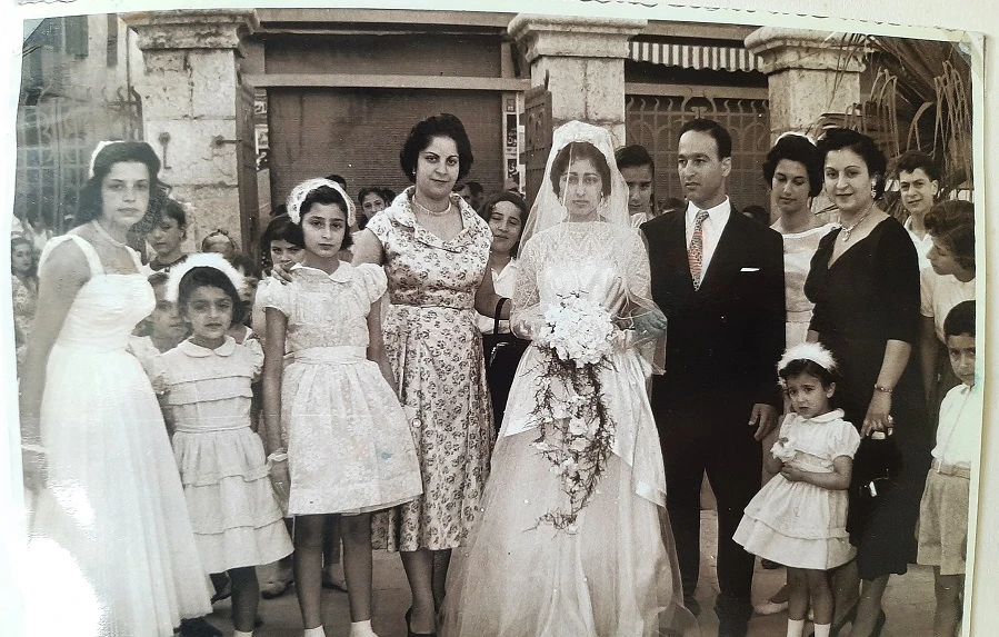 A Jewish wedding party on the street next to the synagogue in Wadi Abu Jamil, Beirut, June 2 1957. (João Luis Koifman)