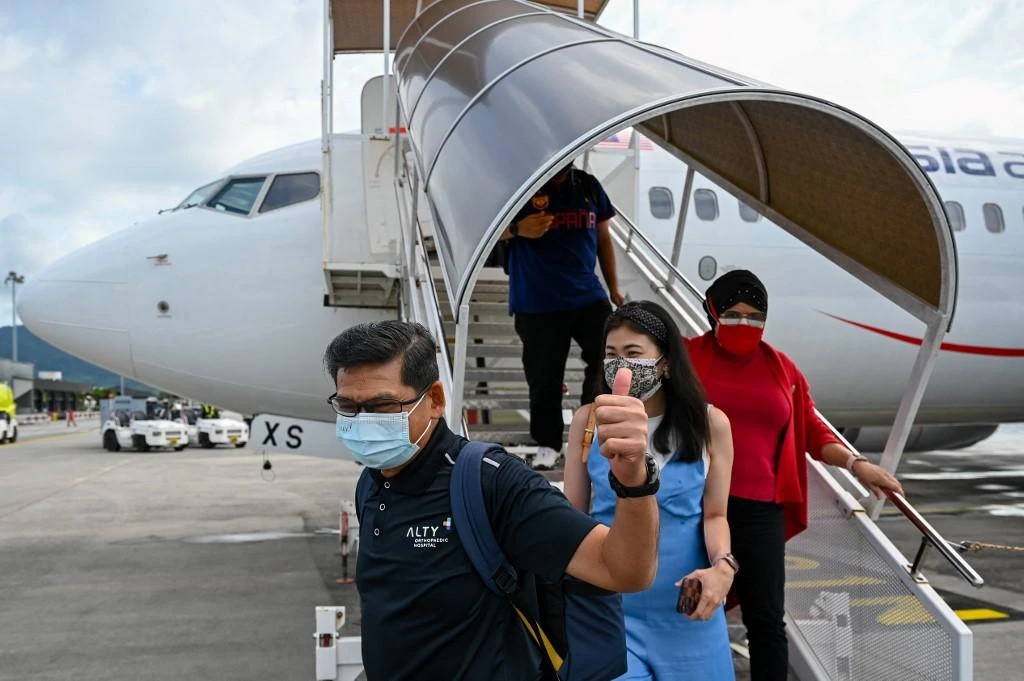 An increasing number of countries are reporting cases of the omicron variant, which the WHO has said carries a very high risk of causing surges of infection. (AFP)