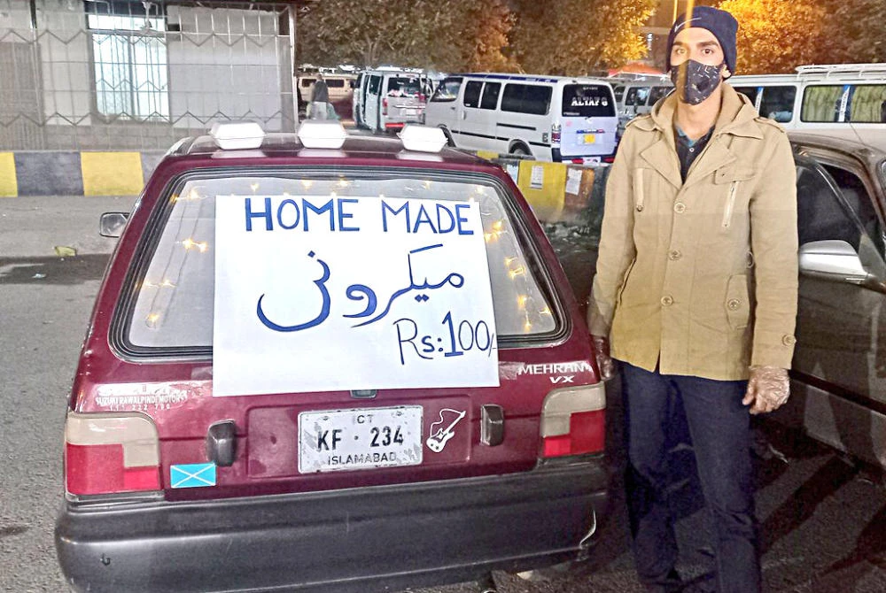 Zaheer Jan’s fortunes changed after a social media user, Maria Malik, shared a picture of Jan standing next to his four-wheeled food stall. (Supplied)