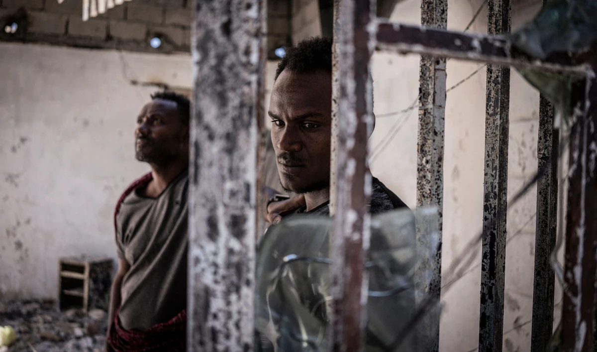 A man looks on at a burned warehouse, allegedly looted by Tigray rebels in Shewa Robit, Ethiopia. (AFP/FILE)