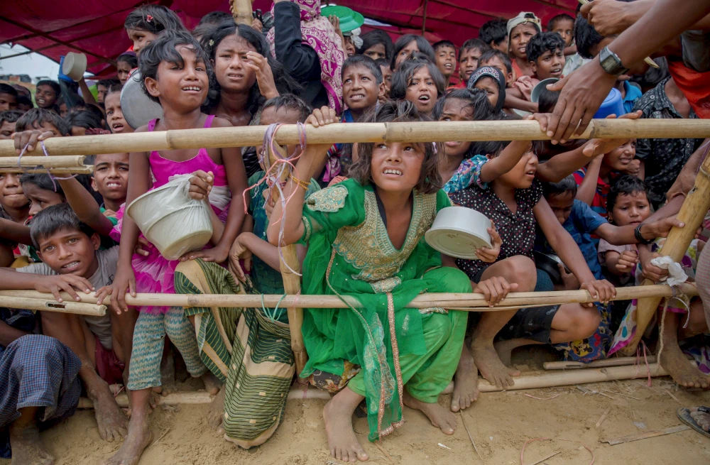 Rohingya Muslim children refugees, who crossed over from Myanmar into Bangladesh, wait squashed against each other to receive food handouts at Thaingkhali refugee camp, Bangladesh on Oct. 21, 2017. (AP)