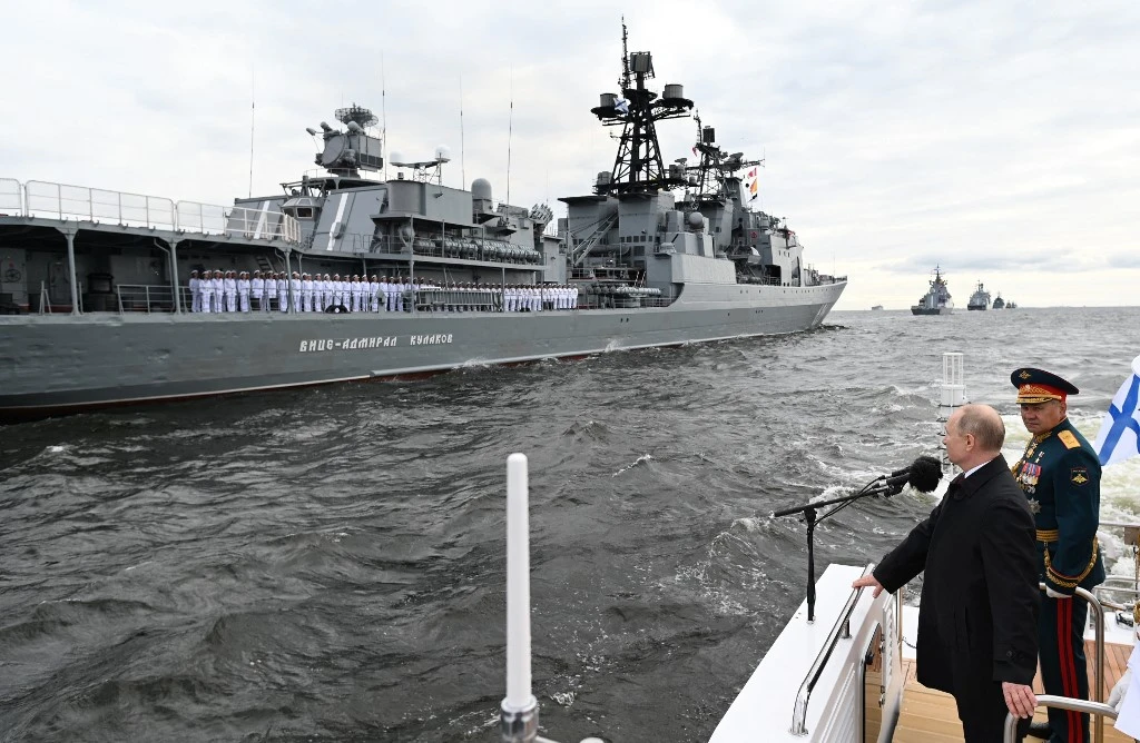 Above, Russian President Vladimir Putin, left, and Russian Defense Minister Sergei Shoigu inspect warships during the Navy Day parade in St. Petersburg on July 25, 2021. (AFP file photo)
