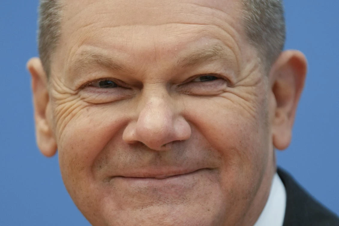 Designated German Chancellor Olaf Scholz smiles during a news conference after the signing of the coalition agreement with two other parties for new German government in Berlin, Germany, Tuesday, Dec. 7, 2021. (File/AP)