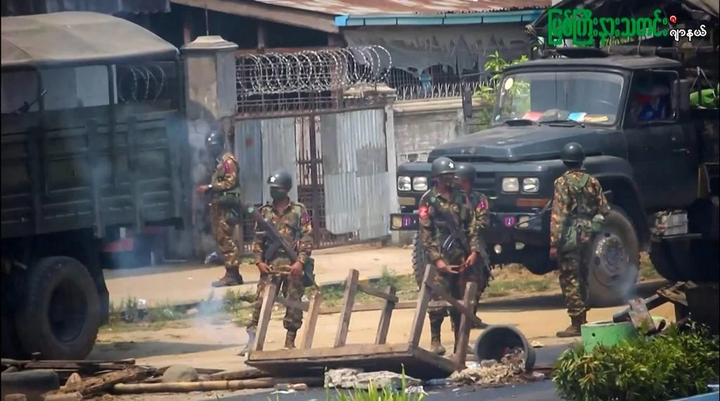 Myanmar has been in chaos since the military overthrew Aung San Suu Kyi’s democratically elected government in February. Above, security forces during a crackdown against a demonstration on March 27, 2021. (Myitkyina News Journal via AFP)