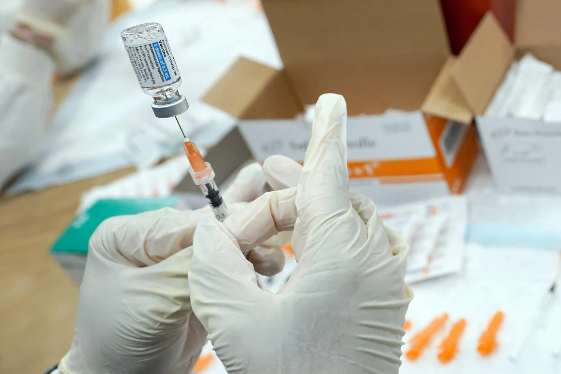 File photo of a registered nurse filling a syringe with the Johnson & Johnson COVID-19 vaccine at a pop-up vaccination site in New York in April. (AP)
