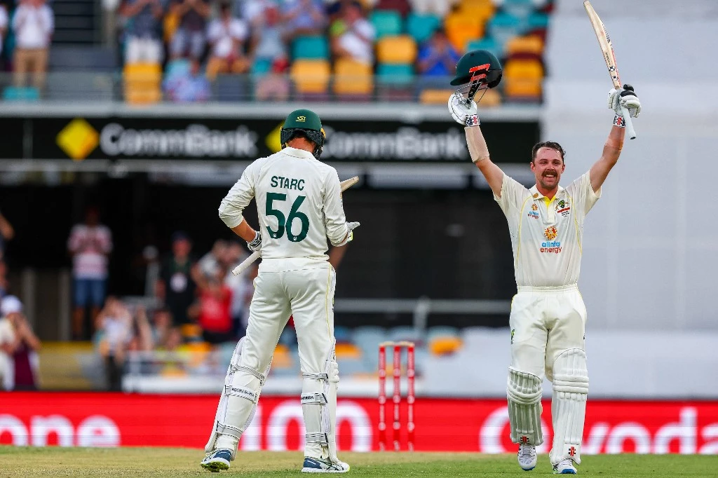 Australia’s Travis Head celebrates his century during day two of the first Ashes cricket Test match between England and Australia at the Gabba in Brisbane on Dec. 9, 2021. (AFP)