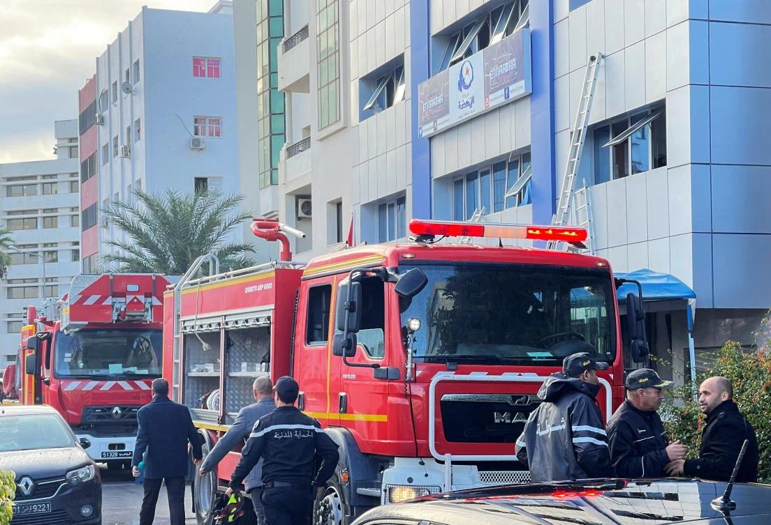 Firefighting vehicles are seen after a fire broke out at the headquarters of Tunisia’s Ennahda party in Tunis, Tunisia December 9, 2021. REUTERS/Jihed Abidellaoui