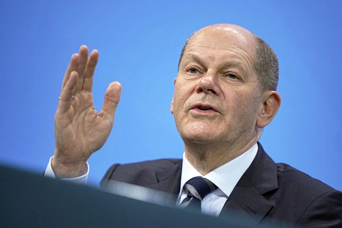 German Chancellor Olaf Scholz attends a news conference in the Federal Chancellery following the video conference with the country’s 16 state leaders on the surge in COVID-19 cases, in Berlin on Friday. (Reuters)