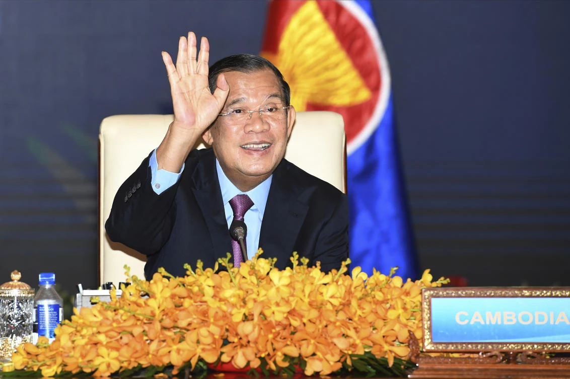 Cambodian Prime Minister Hun Sen gestures as he joins an online meeting of the ASEAN-China special summit at Peace Palace in Phnom Penh, Cambodia, Monday, Nov. 22, 2021. (AP)