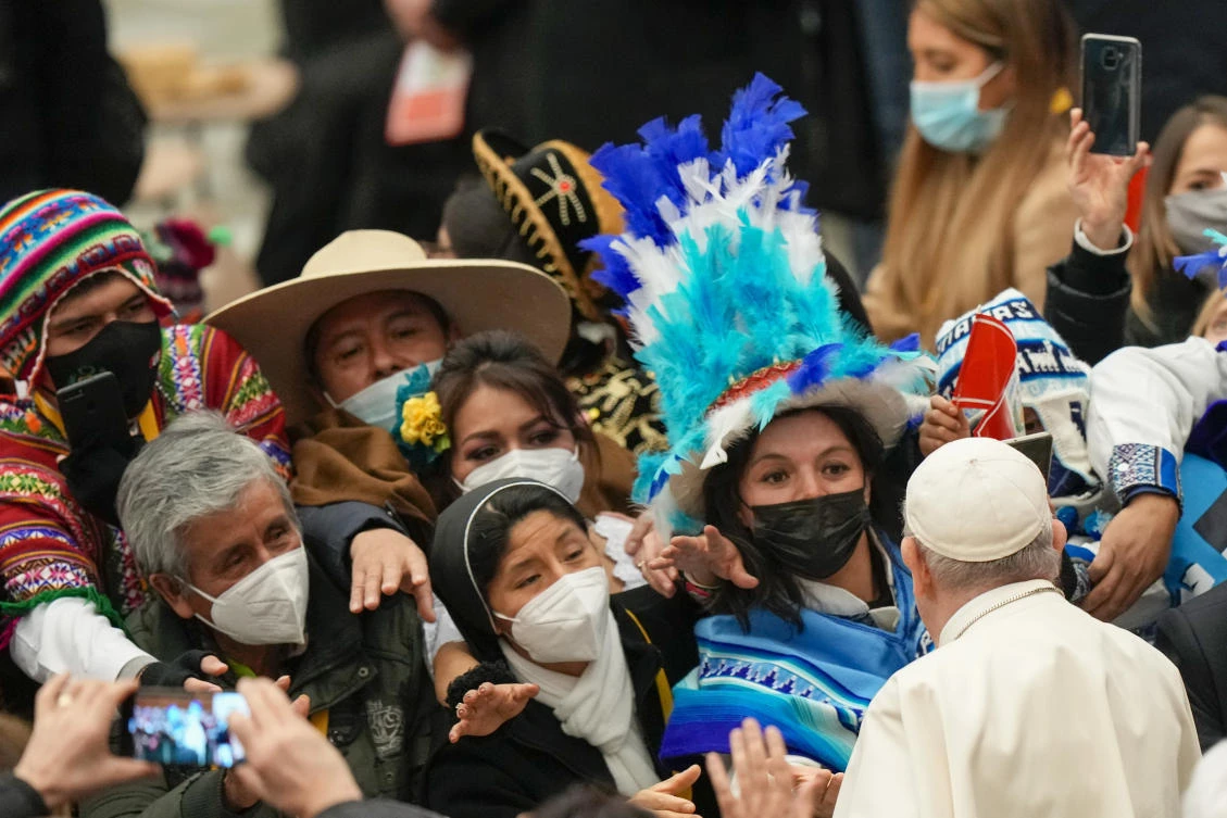Pope Francis greets delegations from the Huancavelica region of Peru, and from Italian town of Andalo, who respectively donated the nativity scene and Christmas tree that adorn St. Peter’s Square on Friday. (AP)