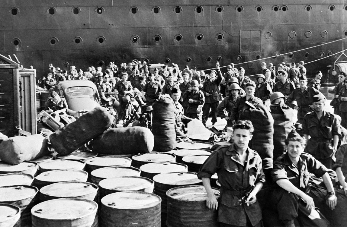 In this file photo taken on May 17, 1956, 3,600 French soldiers and their equipment disembark from the Pasteur’s ship on the docks of Algiers while reinforcements flock to Algeria. (AFP)