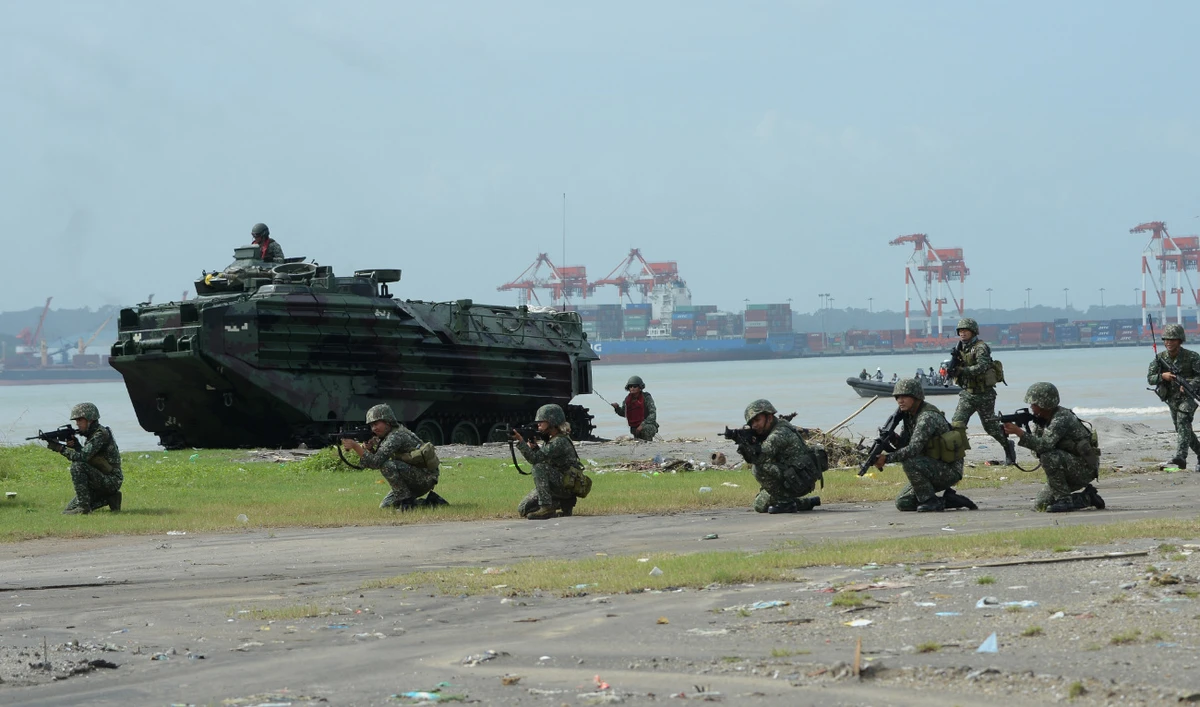 Philippine Defense Secretary Delfin Lorenzana told reporters on Friday that reports of an invasion were “fake news.” (AFP/File)