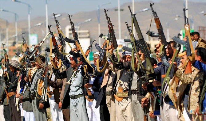 This undated picture shows members of the Houthi militia brandishing their weapons. (File/AFP)
