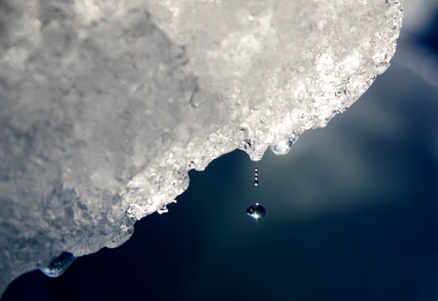 A drop of water falls off an iceberg melting in the Nuup Kangerlua Fjord near Nuuk in southwestern Greenland. (AP/File)