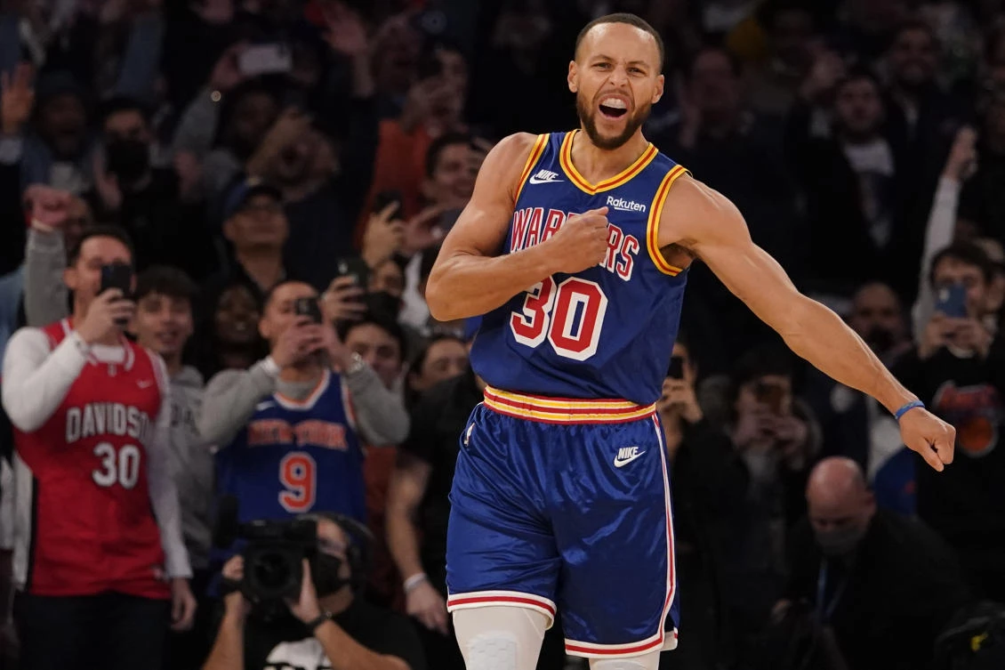 Golden State Warriors guard Stephen Curry reacts after hitting his 2,974th 3-pointer Tuesday night in their game against the New York Knicks, breaking the record set by Ray Allen. (AP)