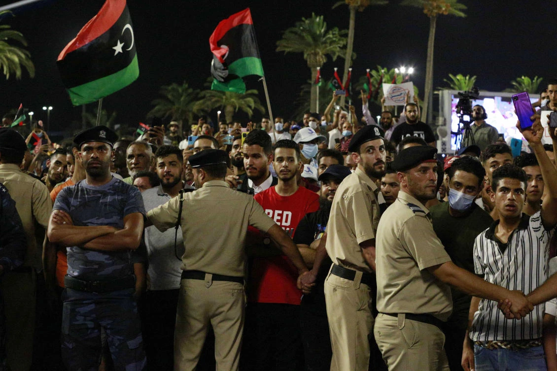 Demonstrators protest in Tripoli, Libya, on Sept. 24, 2021, in opposition to parliament passing a vote of no-confidence in the transitional government. (AP)