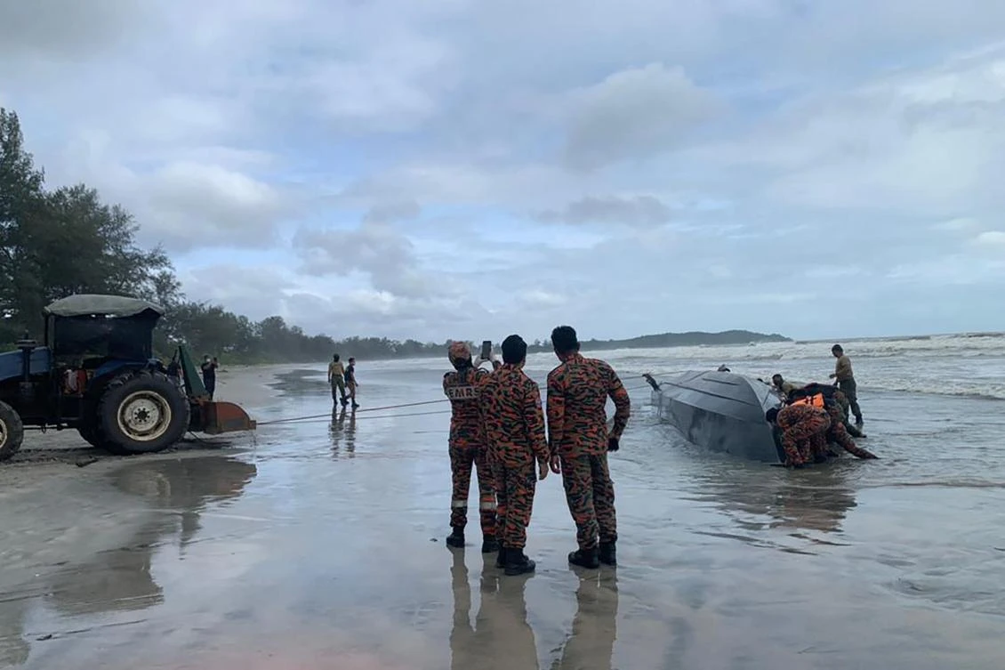 The vessel, believed to be carrying 50 migrants, went down in the morning off Malaysia's southern state of Johor. (AFP)