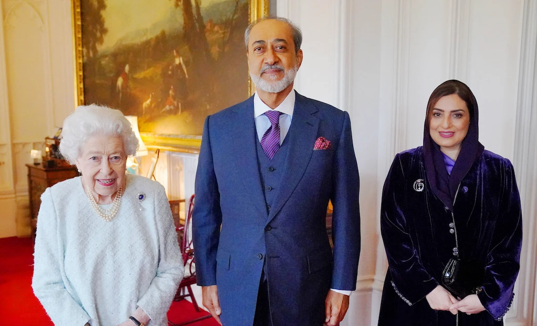 Queen Elizabeth II poses for a photograph with the Sultan of Oman and his wife during an audience at Windsor Castle in Windsor on December 15, 2021. (AFP)
