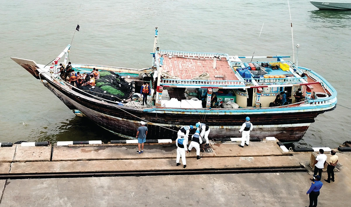 The vessel that was seized with hundreds of kilograms of heroin in a joint operation by the Sri Lanka Navy and the Police Narcotics Bureau is being searched. (Supplied)