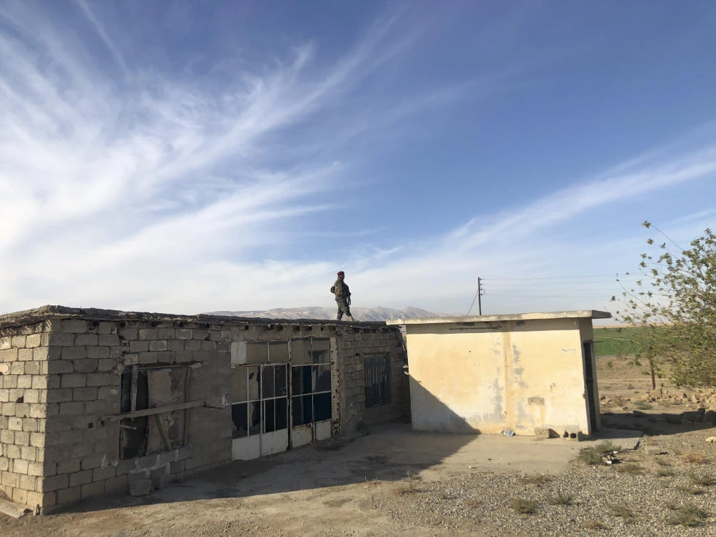 Kurdish Peshmerga soldier stands guard in the village of Lheiban , Iraq, Tuesday, Dec. 7, 2021. (AP)