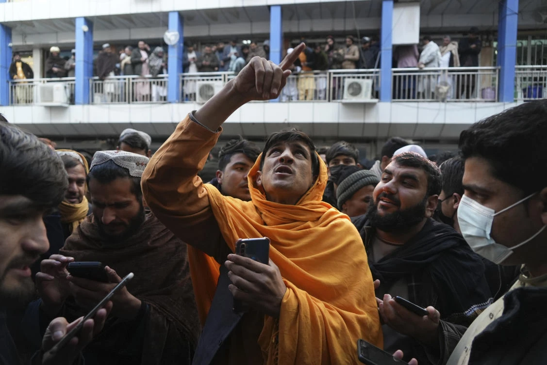 Afghan money changers argue at Khorasan market in Herat, Afghanistan, Wednesday, Dec. 15, 2021. (AP)