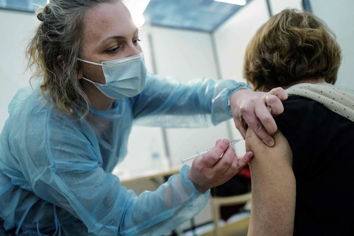 In this file photo taken on March 13, 2021 a member of the medical staff vaccinates a patient at a Covid-19 vaccination centre, located at the Conference centre in Nice. (AFP)