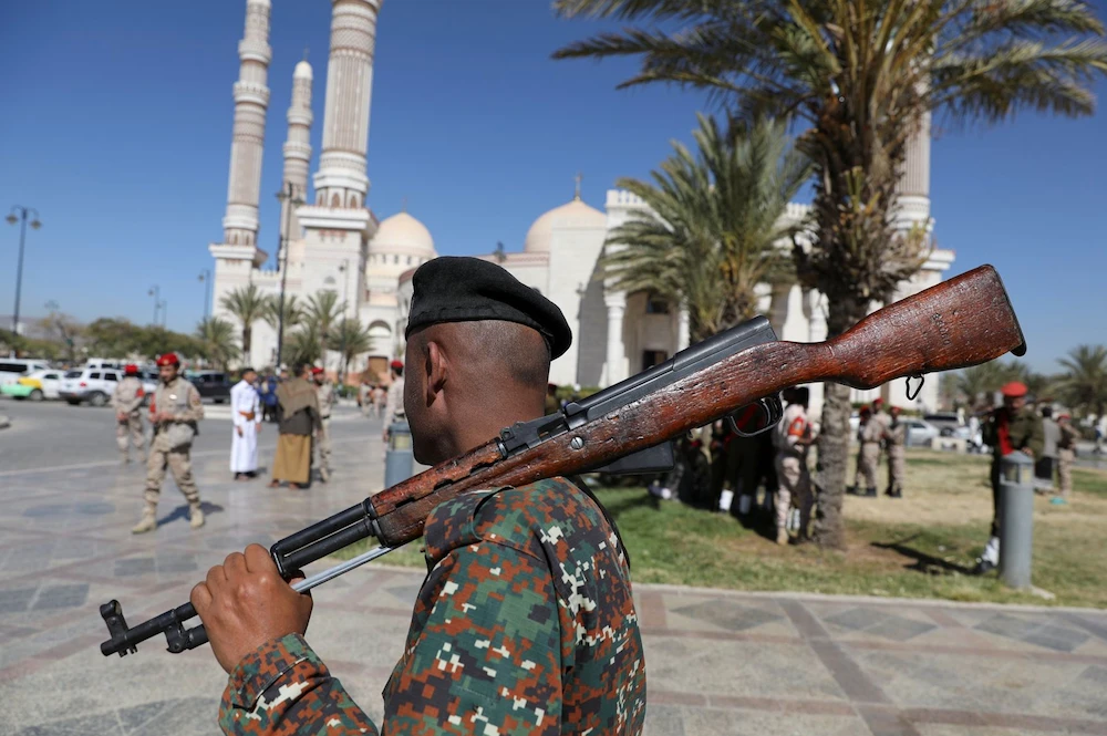 A police trooper ahead of funerals of Houthi fighters in Sanaa on December 6, 2021. (Reuters)