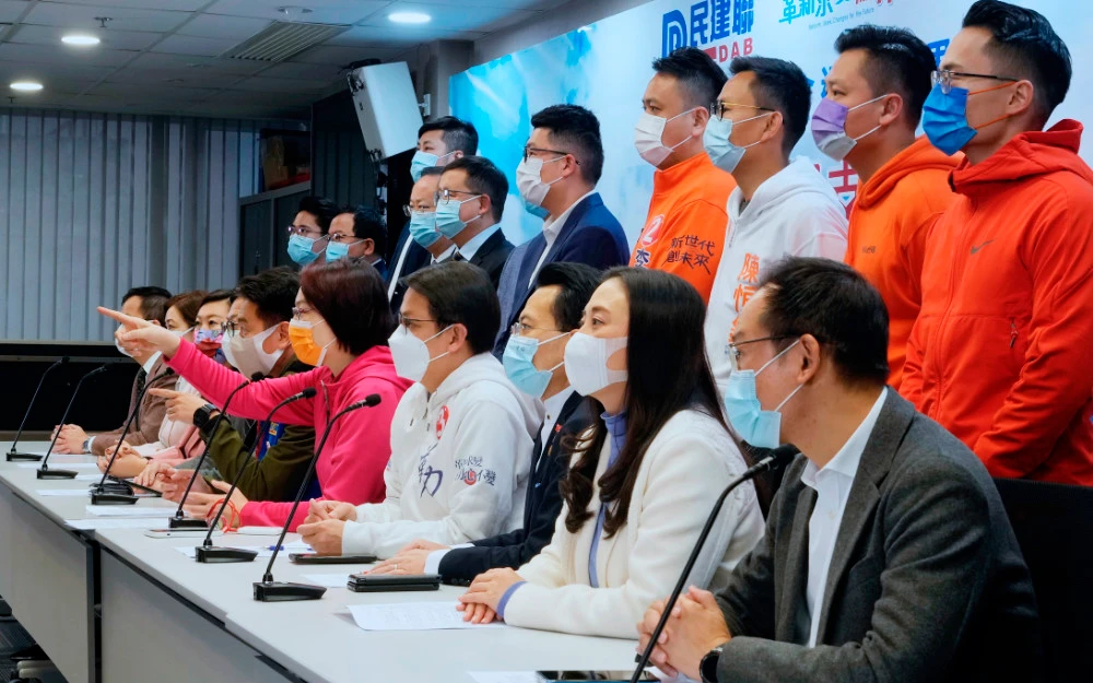 Members of pro-Beijing party Democratic Alliance for Betterment of Hong Kong, including Starry Lee Wai-king, fifth from right, attend a press conference after winning 19 seats in the Legislative election in Hong Kong, Dec. 20, 2021. (AP)