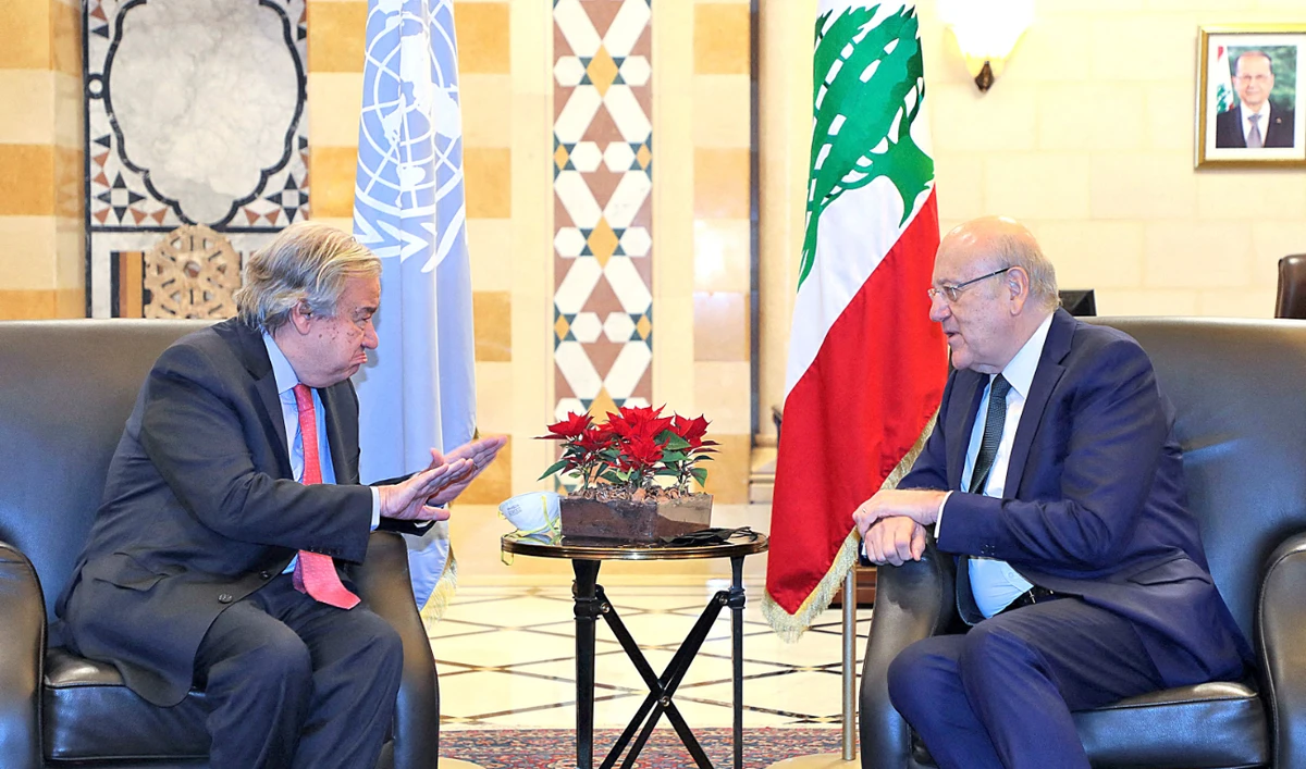 Lebanese Prime Minister Najib Mikati, right, confers with visiting UN Secretary-General Antonio Guterres during a meeting at the government palace in Beirut on Monday. (AFP)