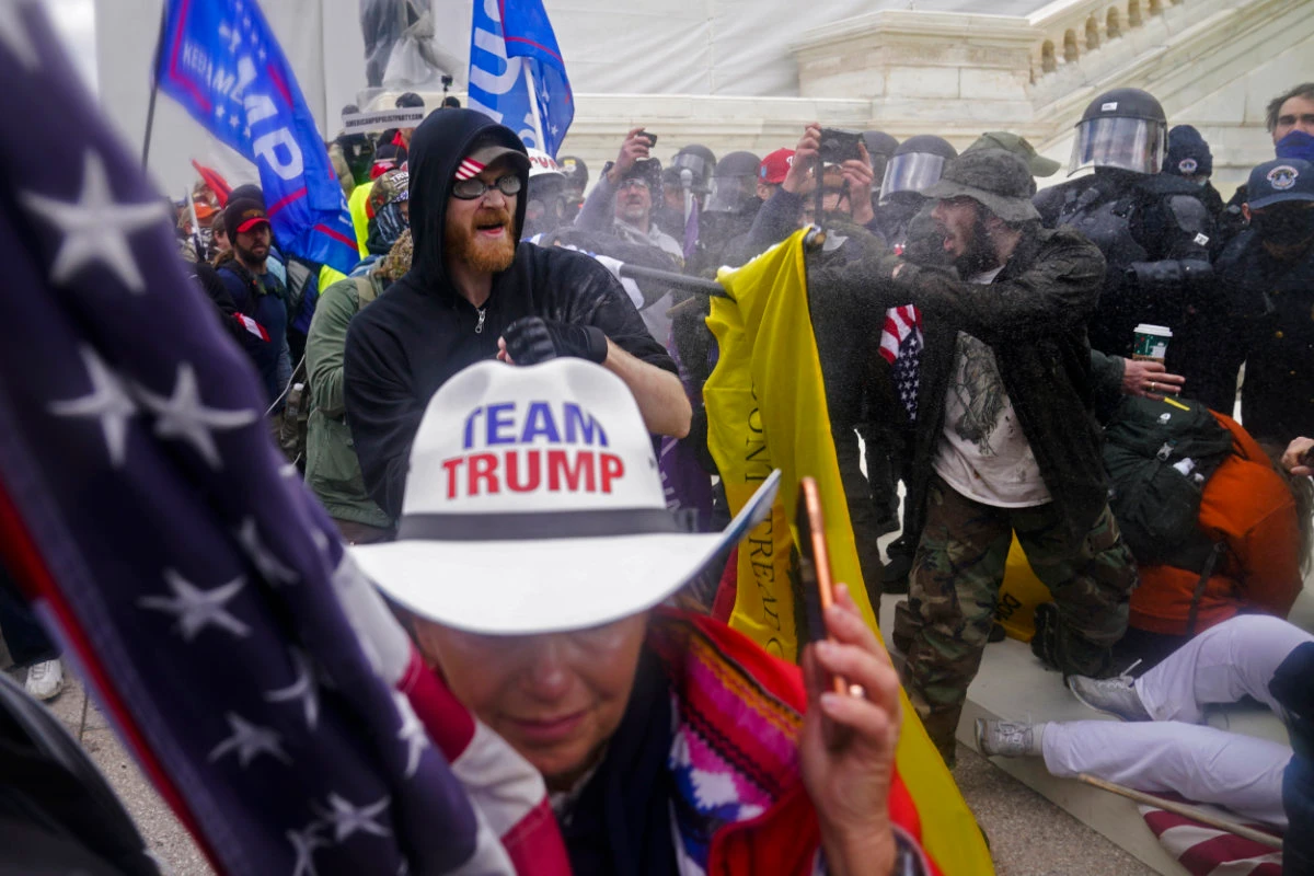 Trump supporters try to break through a police barrier at the Capitol in Washington, on Jan. 6, 2021, as Congress prepared to affirm President-elect Joe Biden's victory. (AP)