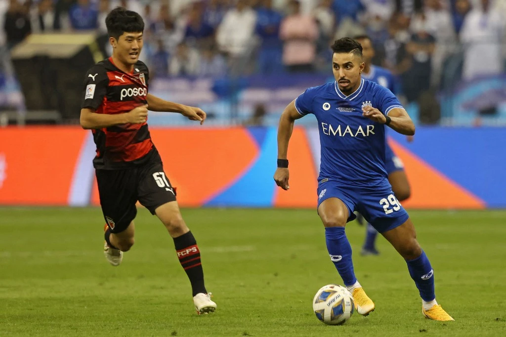 Salem Al-Dawsari, right, has been the best player in the Saudi Professional League with the team that was crowned champions. (AFP)